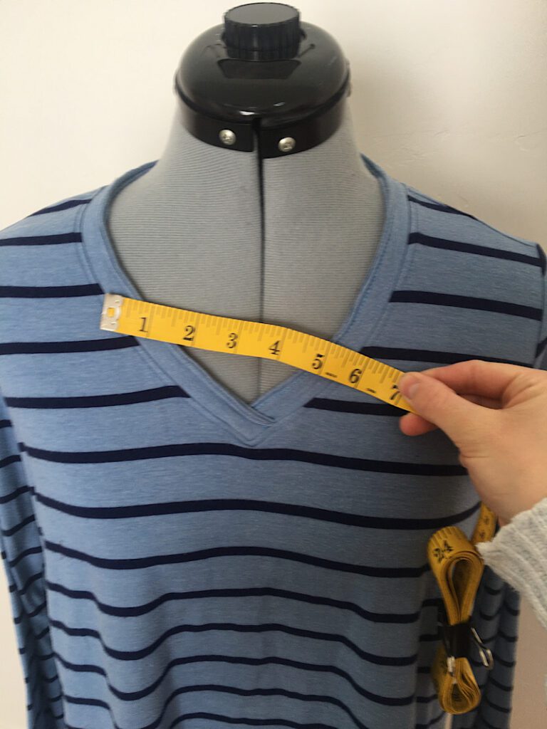 measuring the neckline of the t shirt