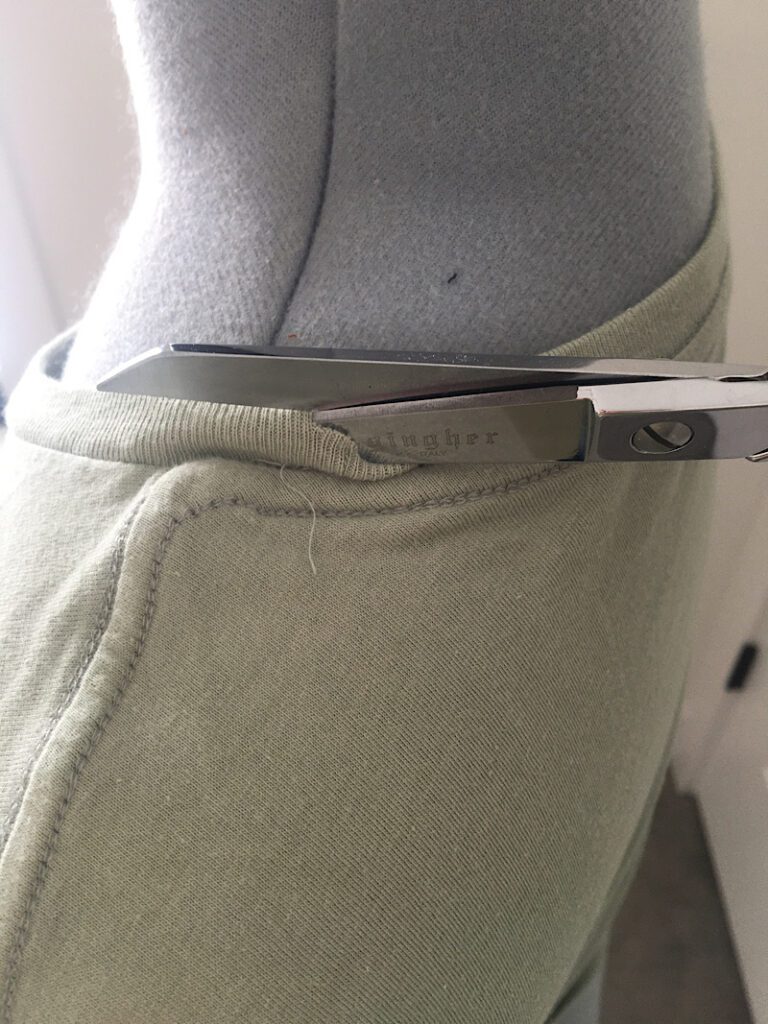 cutting the neckline of a t shirt