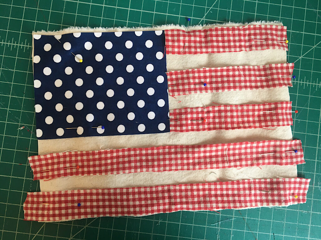 scrappy flag pieces pinned together