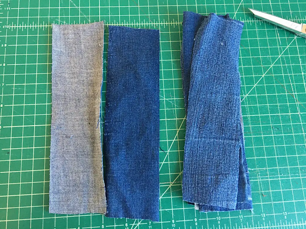cutting strips of denim jeans