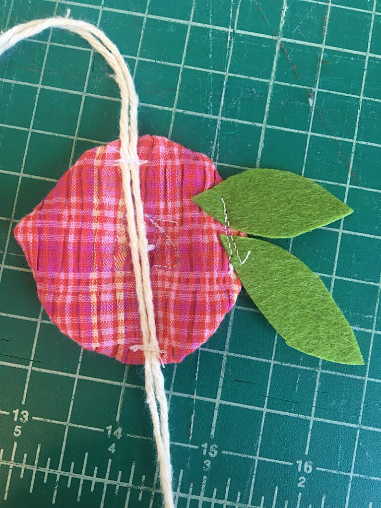 sewing flower to string