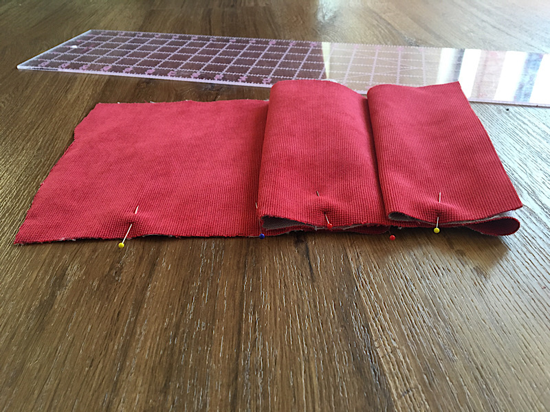 fitting whole pleats on a length of fabric