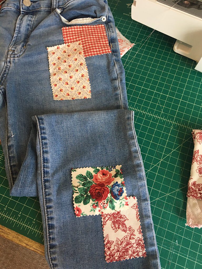 arranging the patches onto the jeans