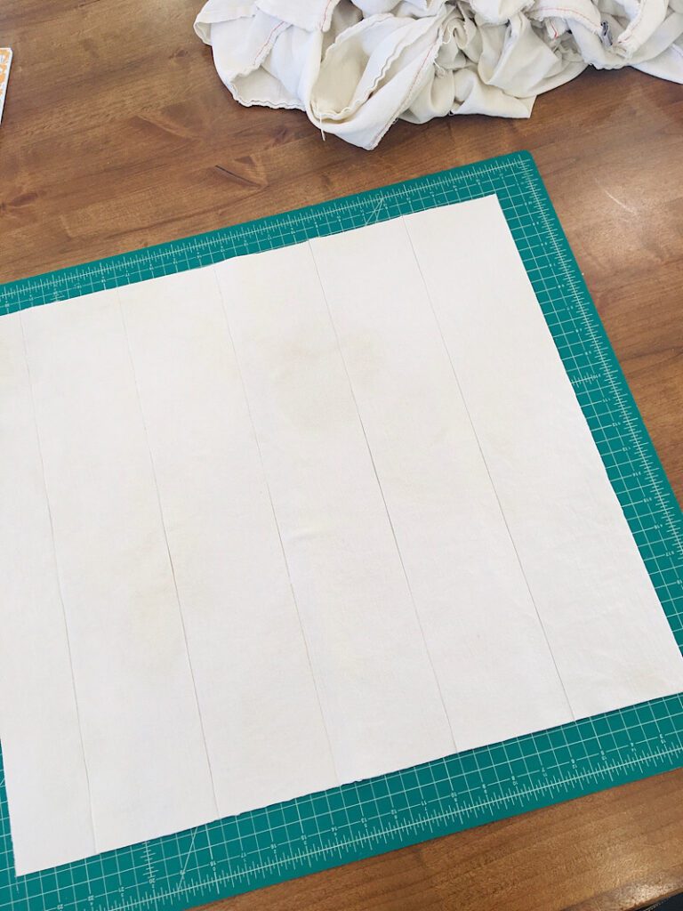 cutting strips of diaper cloth for diy cloth diaper inserts