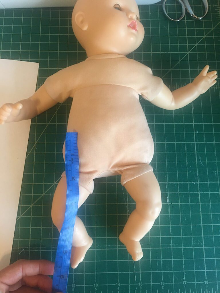 Measuring the length of the doll pants