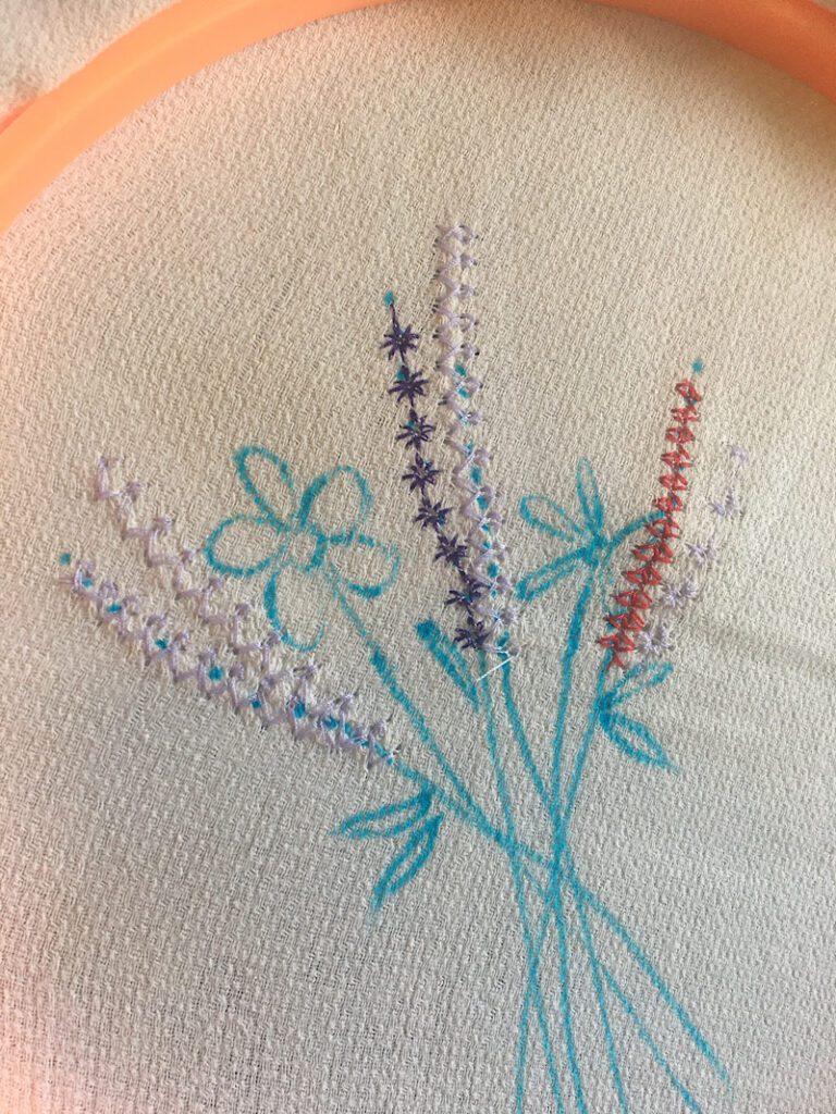 tall flowers on embroidery