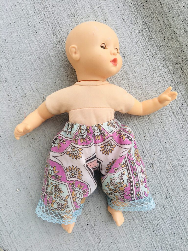 baby doll wearing pants