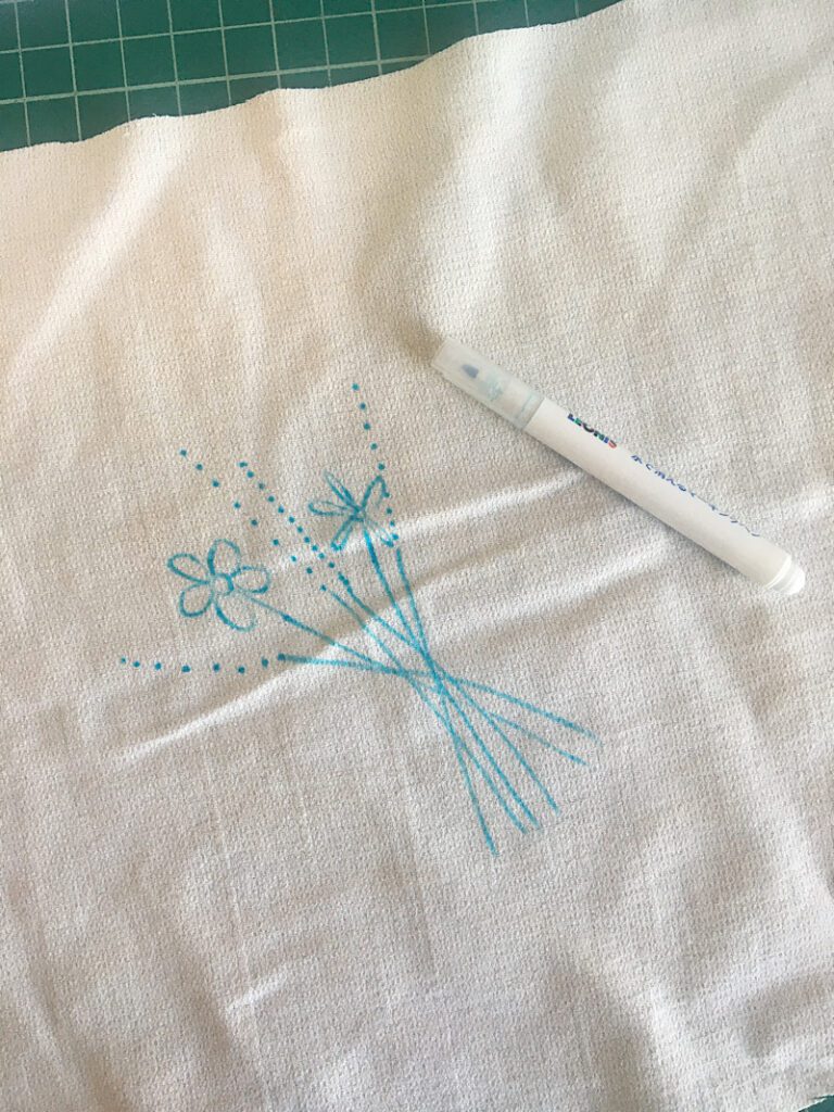 drawing the embroidery pattern onto fabric