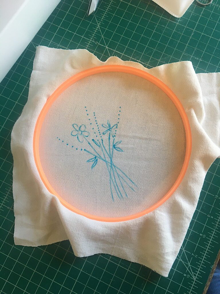 placing the embroidery pattern into the hoop upside down