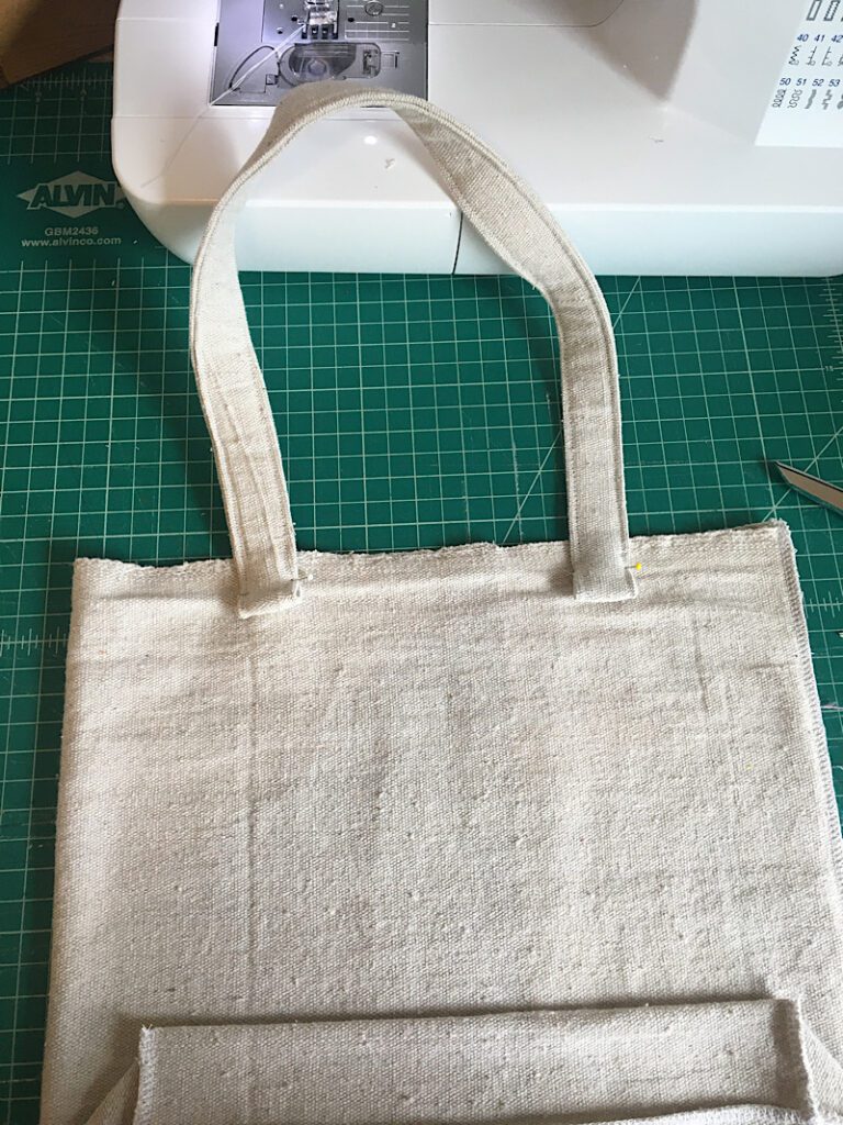 strap pinned to tote bag