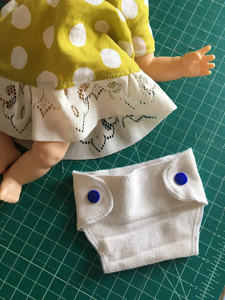 baby doll and fabric diaper