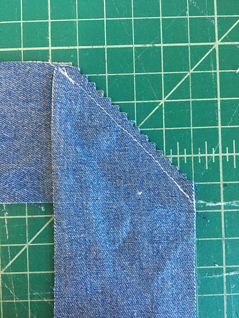 trimming away the excess fabric
