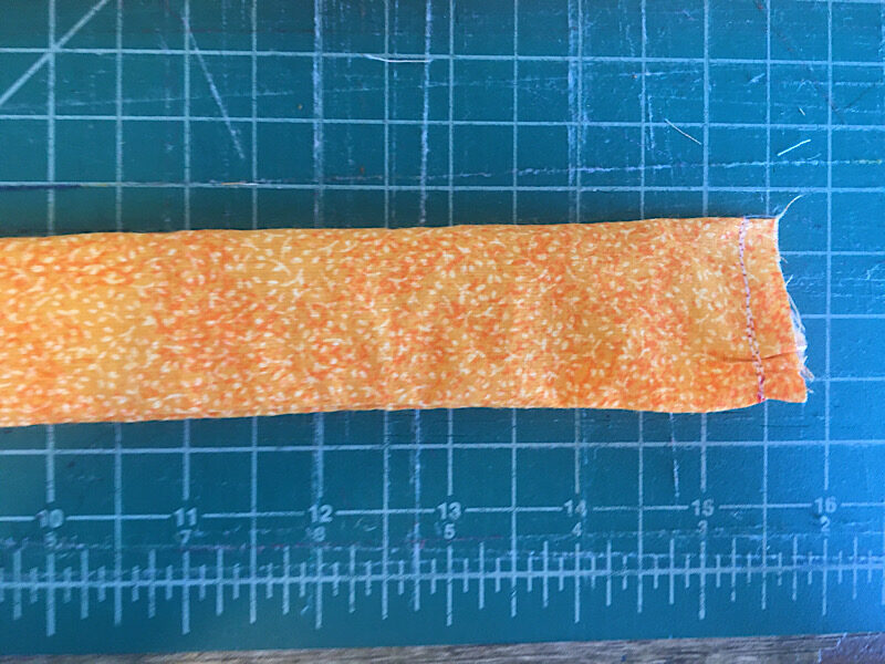 sewing the first edge of the tube