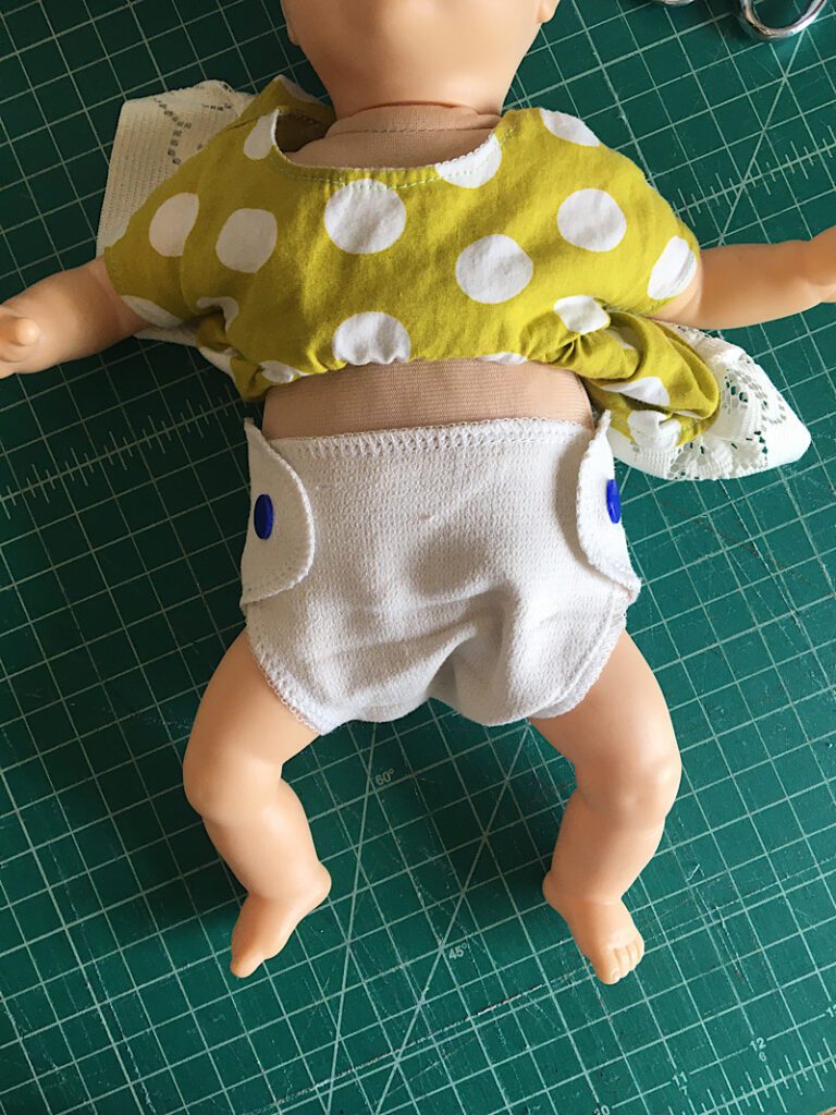diaper on baby doll