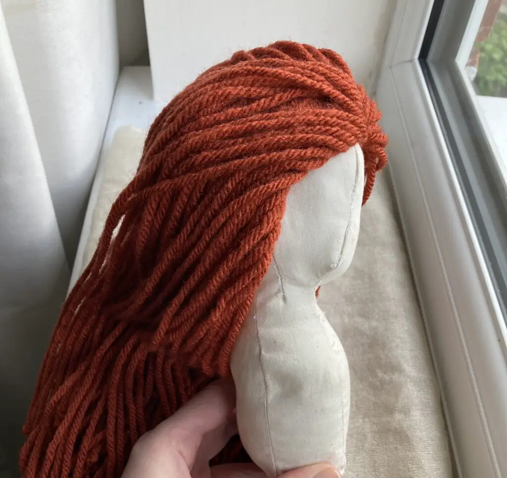 yarn doll with red hair