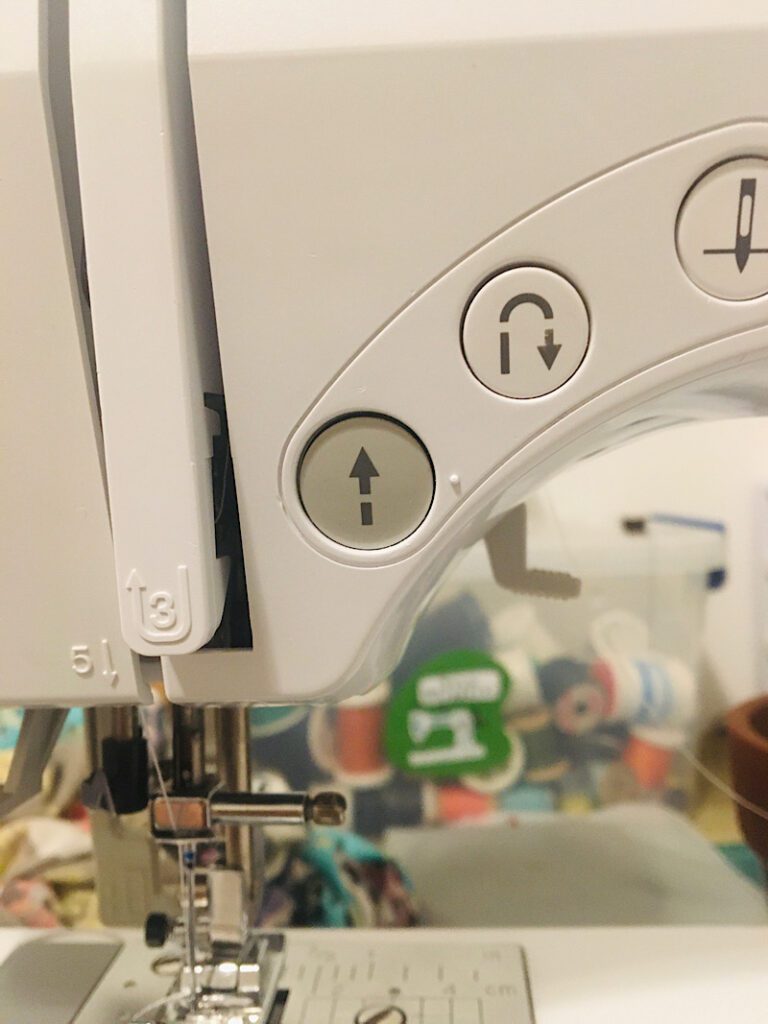 sewing machine reverse button stuck