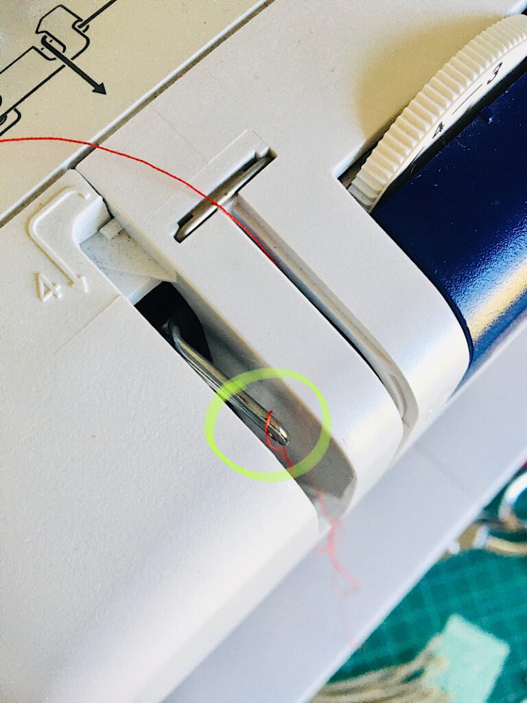 thread wrapped around take up lever sewing machine