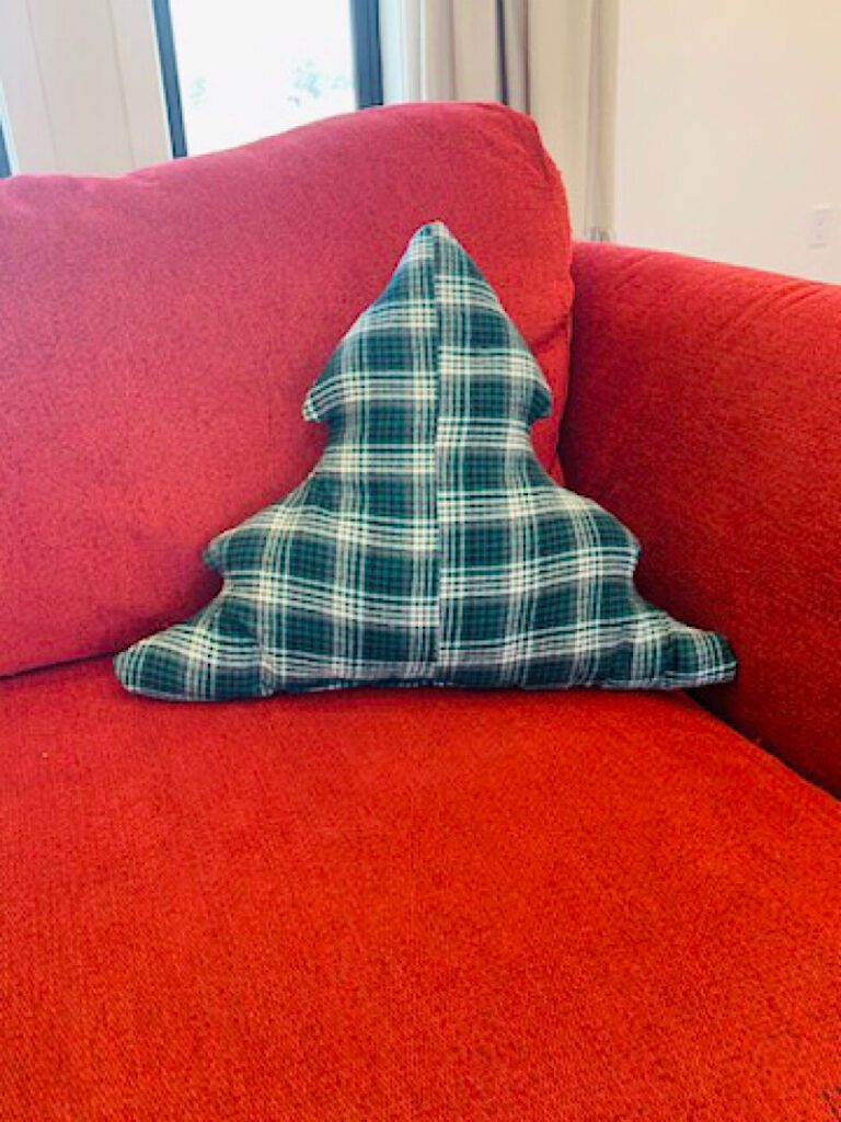 Christmas Tree Pillow on red couch