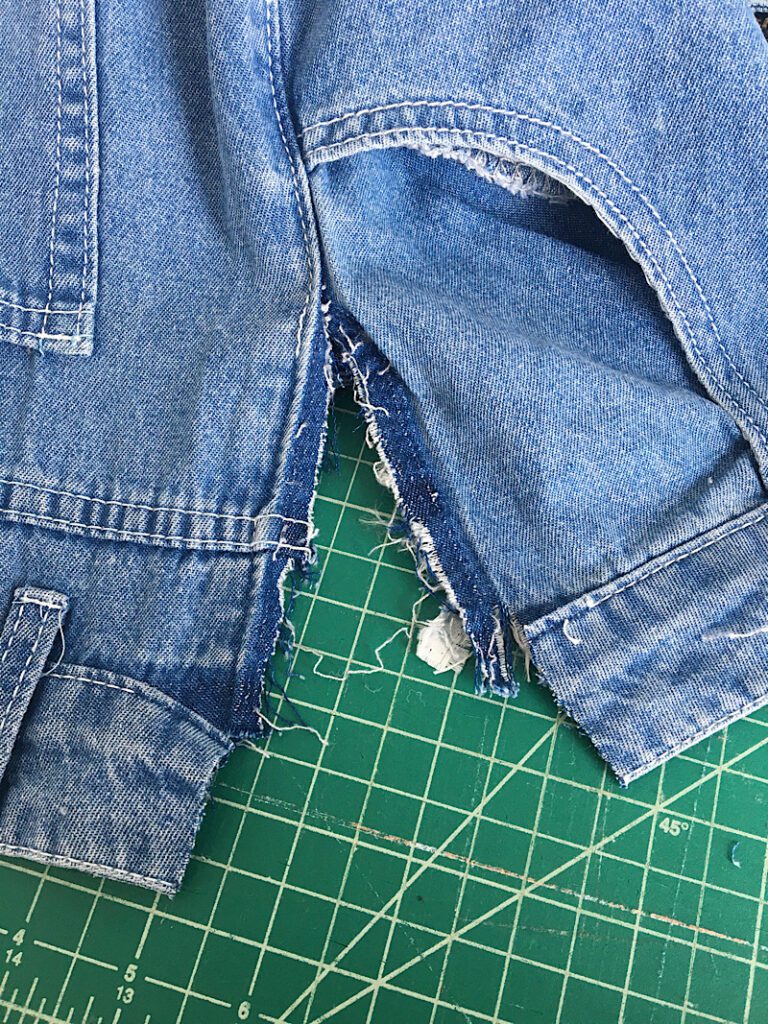 unpicking the waistband and side seams of the jeans 