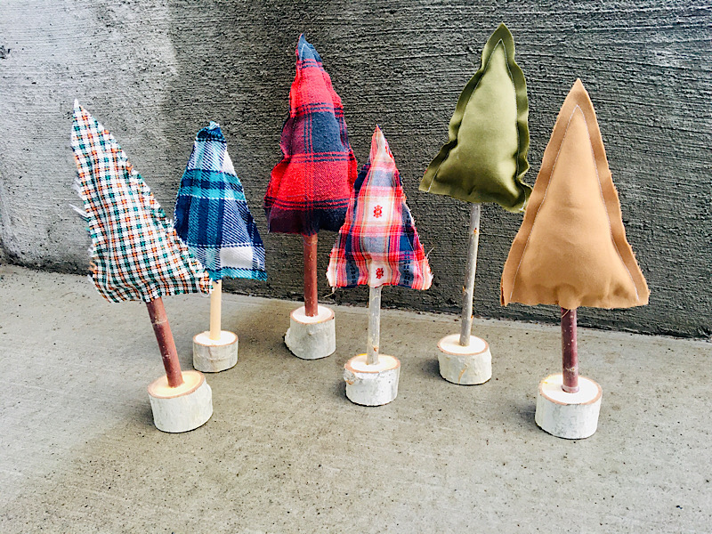 fabric christmas trees in a group