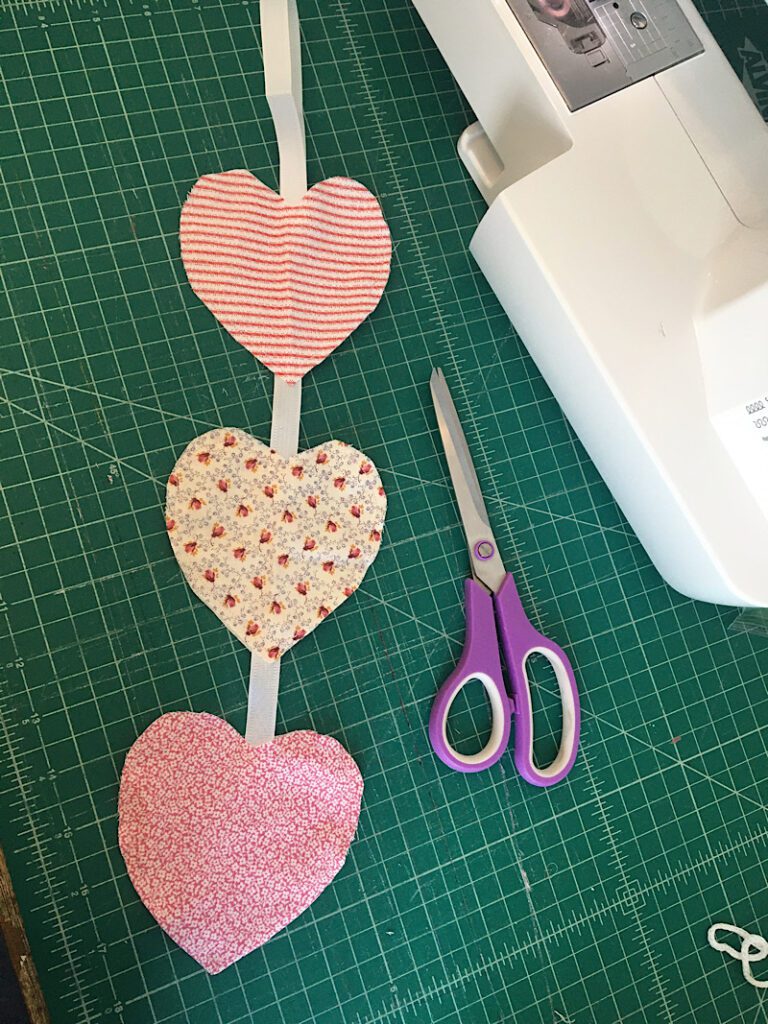 sewing the hearts together