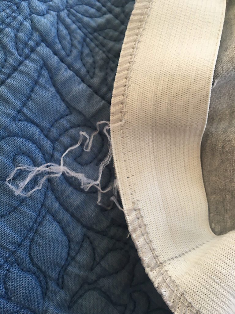 unpicking the serged stitch looped threads