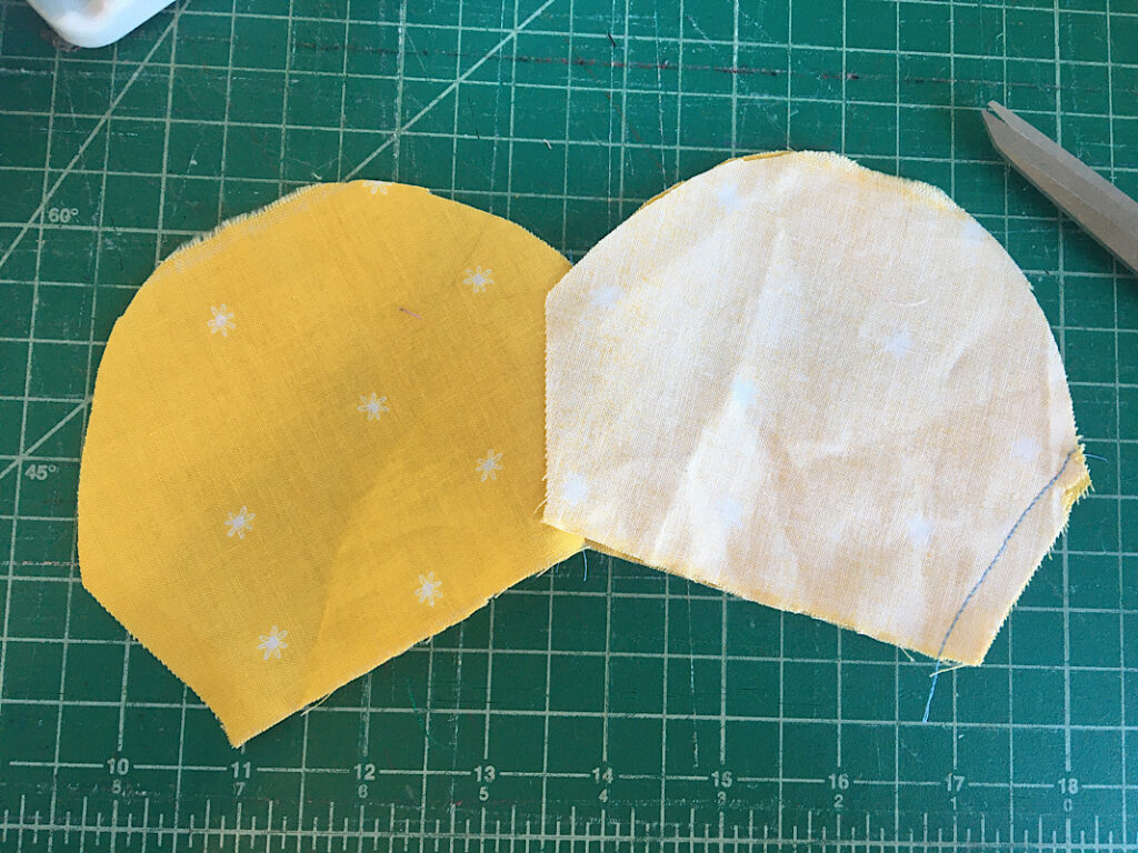 Sewing daisy bowl cozy petals together