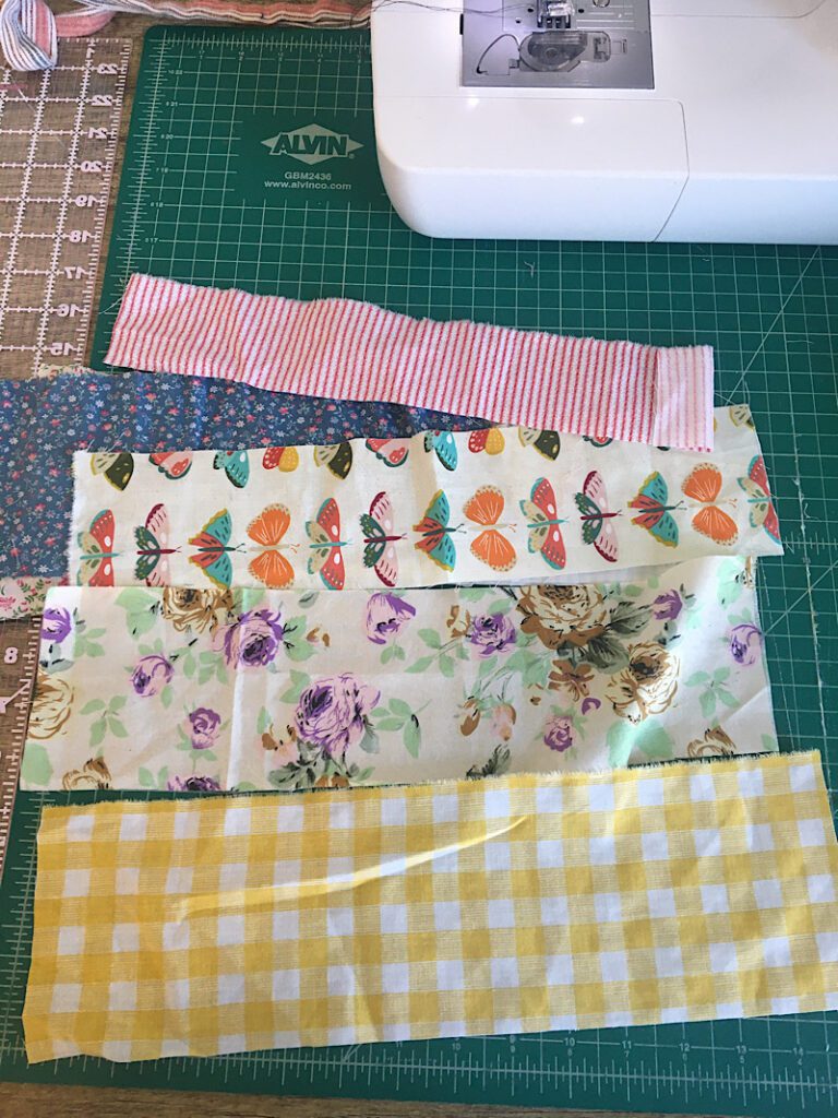 cutting fabric scraps into strips