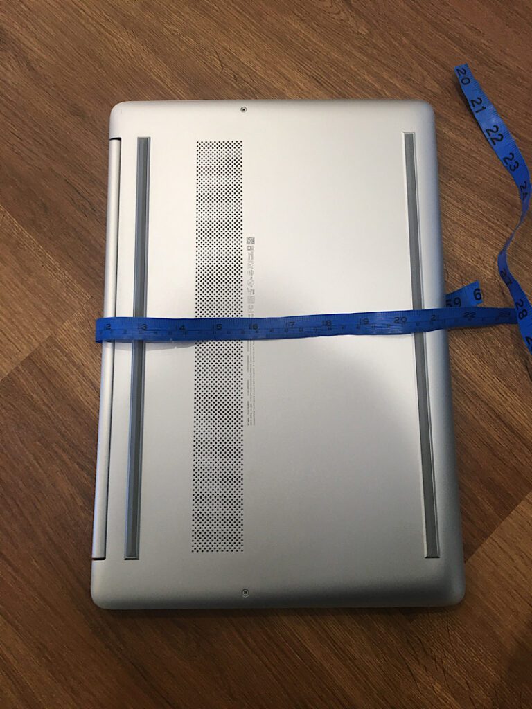 measuring around laptop