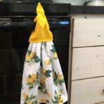 kitchen towel with lemons and yellow tie top detail