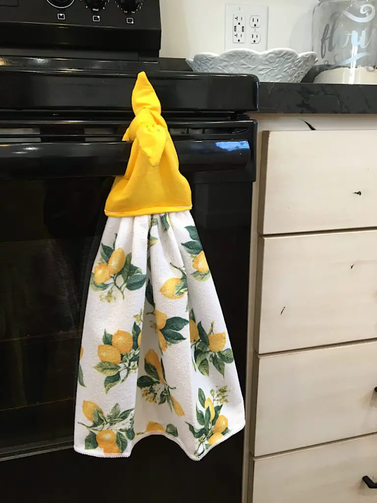 kitchen towel with lemons and yellow tie top detail