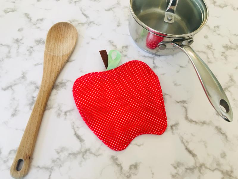 apple pot holder and spoon and pot