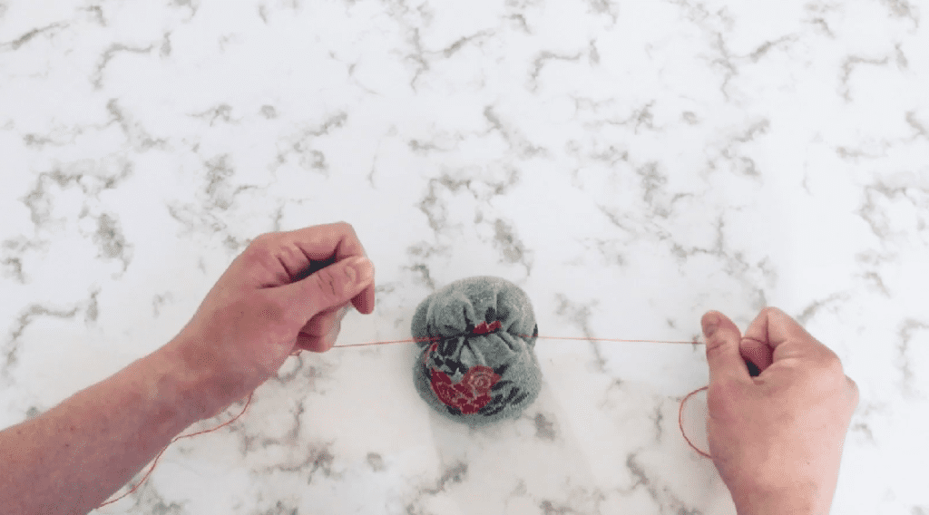 tying string around pumpkin