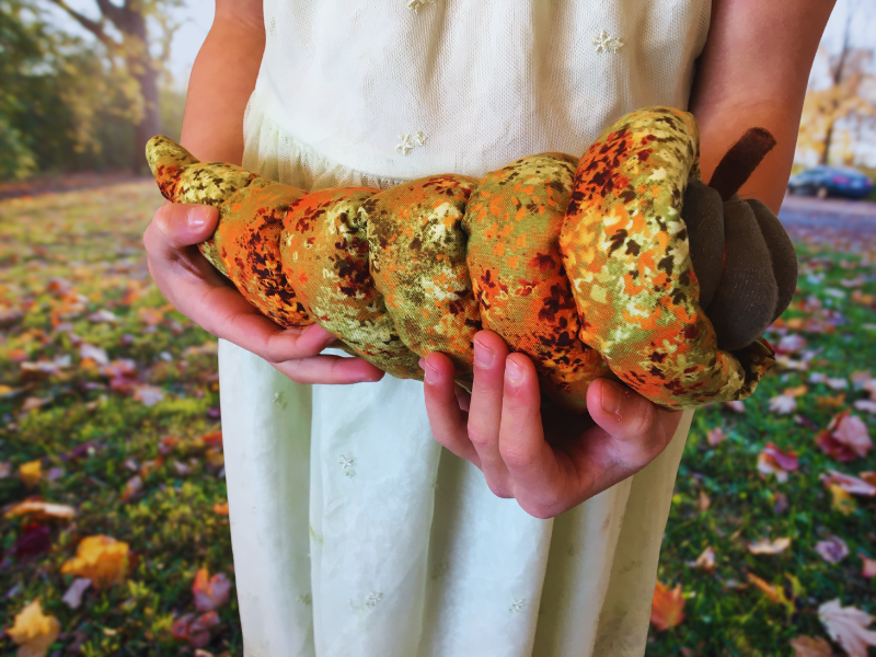 CLOSEUP of girl holding fabric cornucopia