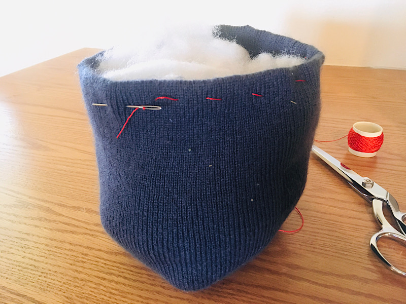 Running stitch on pumpkin beanie