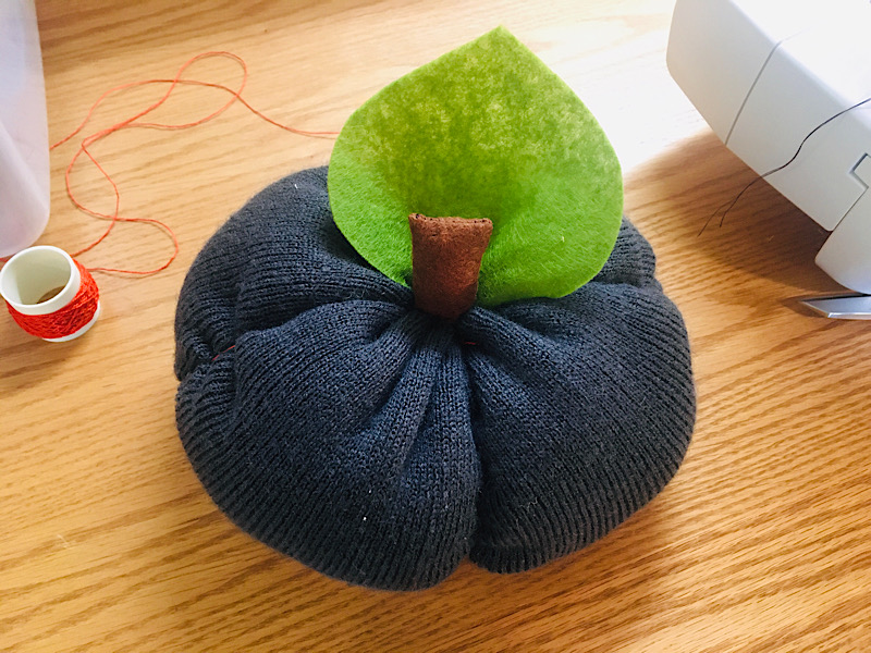 sew leaf to base of pumpkin stem