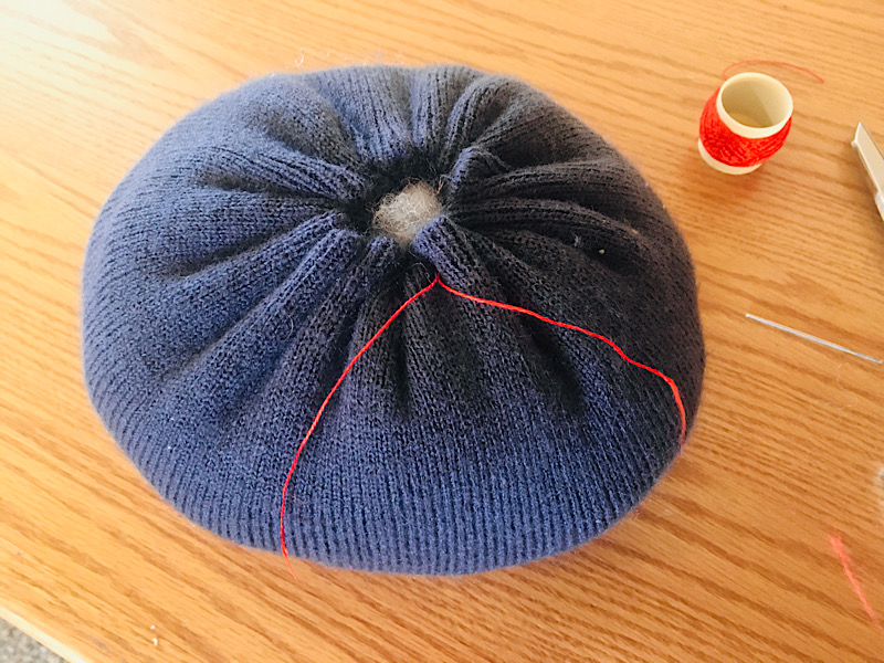 tying beanie pumpkin closed