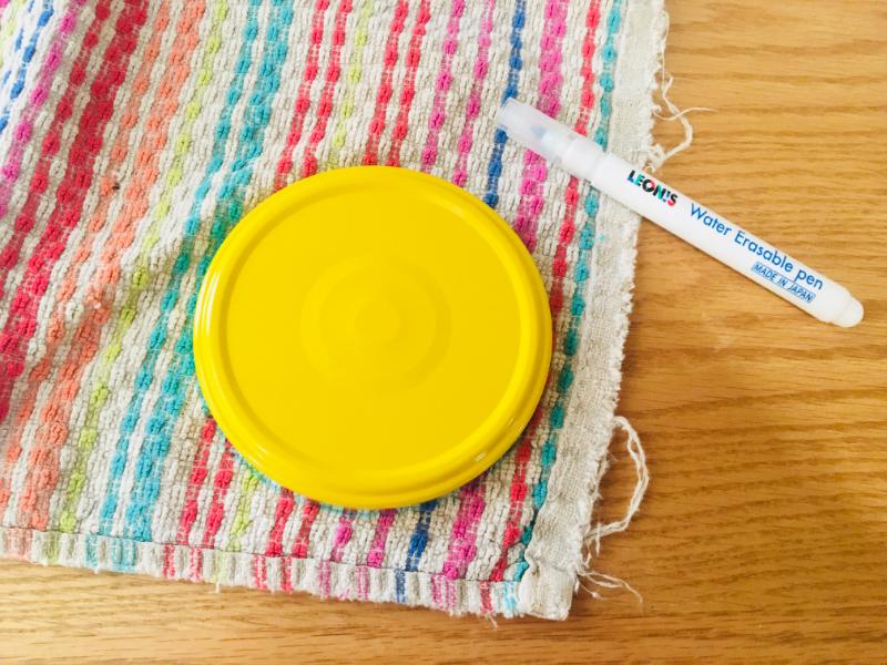 tracing a lid onto an old towel