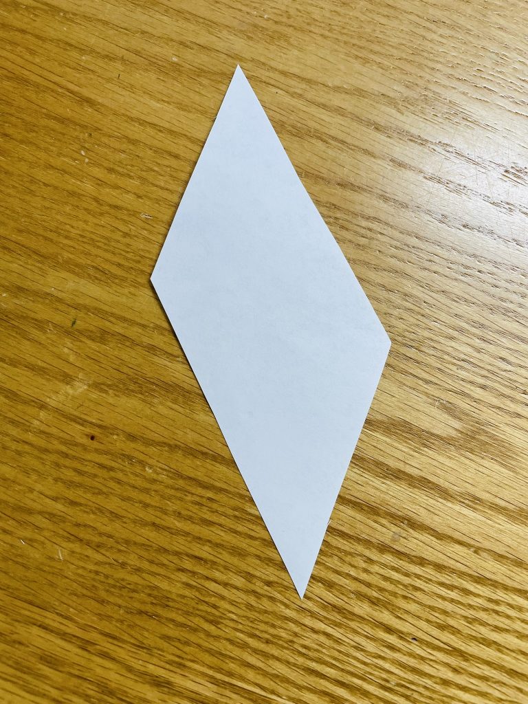 paper template of a parallelogram for an 8 pointed star