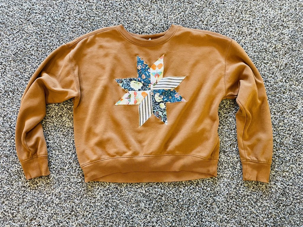 brown sweatshirt with DIY 8 pointed star quilt block applique on front